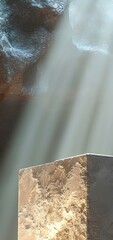Stone pedestal in cave with dramatic sunlight beams