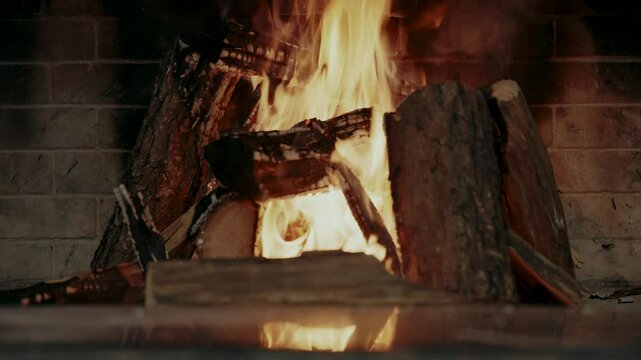 Wood is burning in the fireplace