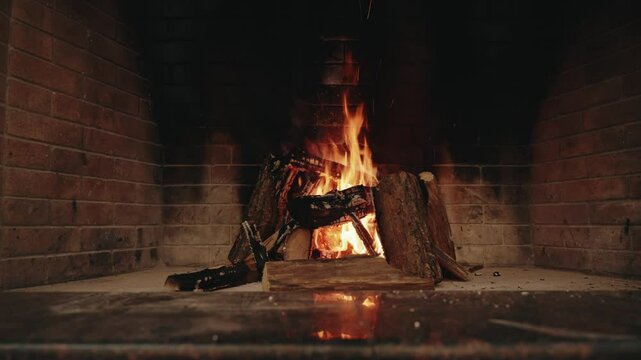 Wood is burning in the fireplace