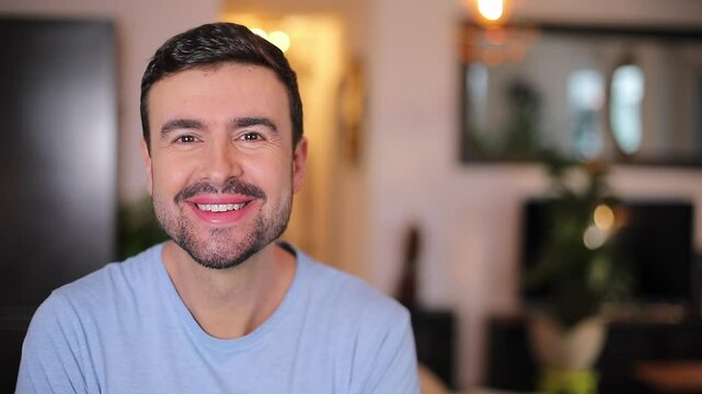 Good looking man with a beard smiling 
