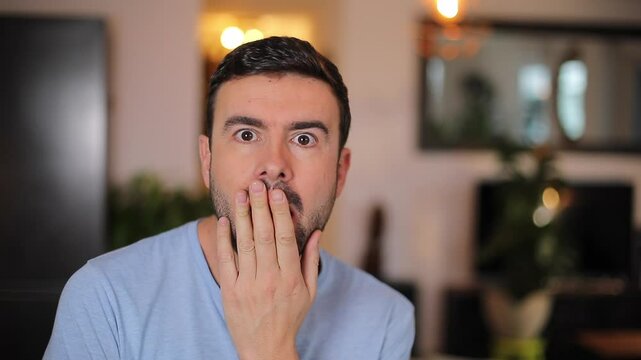 Man listening to something shocking 