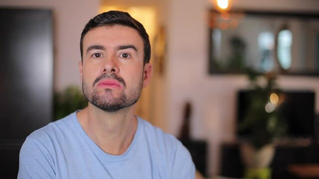 Comedic annoyed looking man showing his middle finger