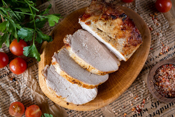 Slices of pork on a board. Homemade pork for lunch. Close-up