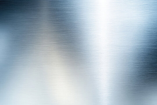 Brushed steel texture showing a cool, sleek, metallic sheen with subtle variations in tone and light reflection.