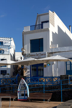 ARRECIFE, LANZAROTE, CANARY ISLANDS - FEBRUARY 13, 2025:  Exterior view of the pretty La Chalana del Charco restaurant on Avenue Cesar Manrique