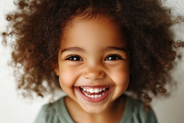 Joyful Smiling Child with Curly Hair
