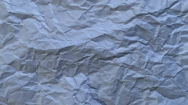 Crumpled white paper ball transition animation into stop motion paper texture background on a green screen. Perfect for editing, backgrounds, motion graphics, and digital projects.