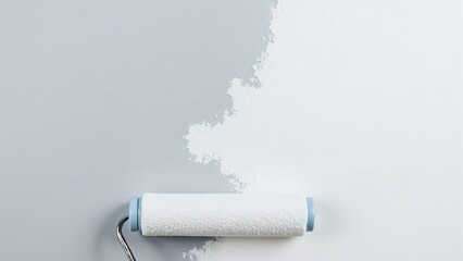 Obraz premium Close-up of paint roller applying fresh color to gray surface, showcasing home improvement and renovation process in action.