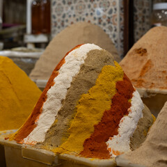 Colourful herbs and spices for sale in the souk bazaar in Meknes, Morocco. Photographed in the kissaria, covered market.