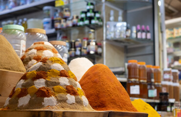 Colourful herbs and spices for sale in the souk bazaar in Meknes, Morocco. Photographed in the kissaria, covered market.