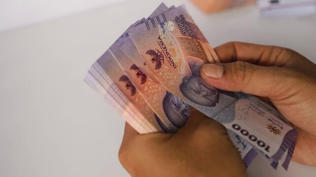 Counting Indonesian Rupiah, Finance, Investment, and Money Concepts