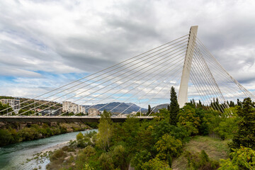  Panoramic view of Podgorica with Moraca river and modern Millennium bridge architecture in Montenegro's capital city