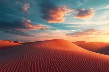 Majestic sunset over serene sand dunes with vibrant clouds illuminating the desert sky near a remote oasis in the golden hour