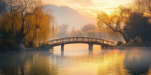 Naklejka premium Serene landscape featuring a wooden bridge over a calm lake at sunrise.