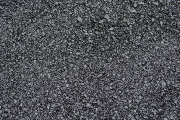 Close-up of rough asphalt pavement texture
Detailed view of coarse asphalt surface, showing...