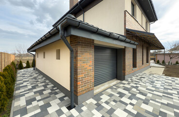 Gray plastic gutter system on a house