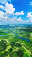 Beautiful grasslands, rivers winding through the green hills under a blue sky and white clouds, phone wallpaper
