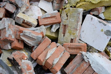 Pile of Broken Bricks and Construction Debris
Stack of shattered red bricks and concrete rubble,...