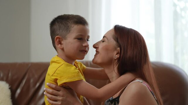 A beautiful moment between a loving mother and her son, showcasing their deep affection and connection