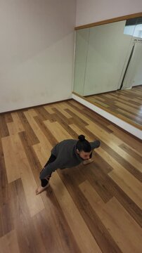 In Gym Indoor A Woman Does Stretching Exercises To relax After Work