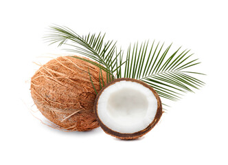 Fresh coconuts and green palm leaves isolated on white