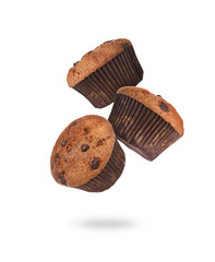 Yummy chocolate chip muffins falling on white background