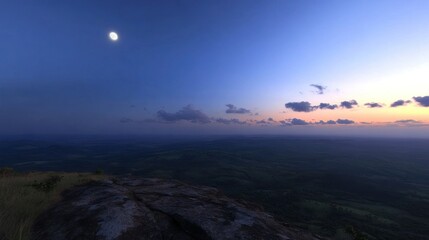 Obraz premium Serene landscape view of a moonlit mountain and valley at dusk or dawn