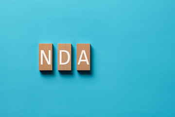 There is word card with the word NDA. It is an abbreviation for Mutual Non-Disclosure Agreement as...