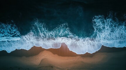 Fototapeta premium Aerial view of waves crashing on a beach, serene, tranquil, calming image.