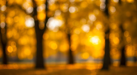 Blurred golden autumn background with warm bokeh lights