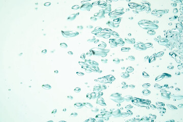 Many water bubbles on light background, closeup