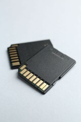 Two SD memory cards on white background, closeup
