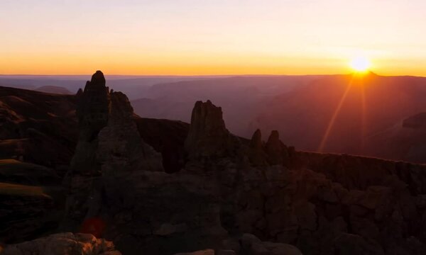 hills with rocks at sunset