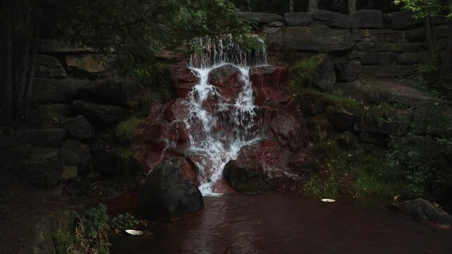 Waterfall in the park in summer. Keeley Falls in Andrew Haydon Park in Ottawa, Canada