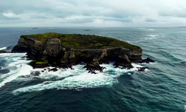 Drone view of the rocky Skriplev Island in the middle of the sea