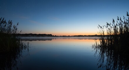 Fototapeta premium Calm Lake Before Sunrise with Star Reflections