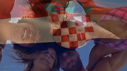 Smiling friends at beach with Croatian flag overlay, enjoying summer animation - Powered by Adobe