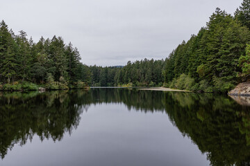 Upper Thetis lake at Thetis Lake Regional Park calm water and overcast day