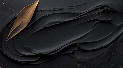 Obraz premium Abstract black background with gold leaf