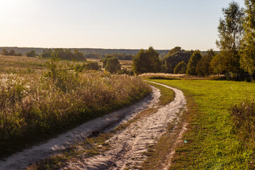 Dirt road going downhill in a picturesque area