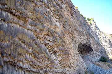 Wonderful natural rocks, formed of regular hexagonal cylinders of Symphony of Stones or Basalt organ. Azat Canyon, Garni, Armenia