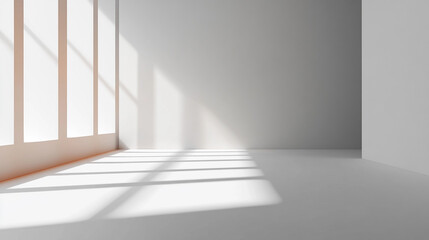 Fototapeta premium Sunlight streaming through window casting shadows on the floor in an empty white minimalist room