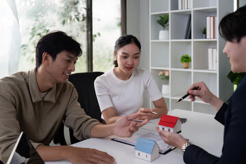 Property Features and Client Satisfaction. A couple discussing home possibilities while engaging with their agent.