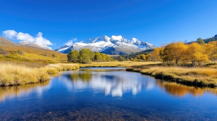 Serene alpine lake reflecting autumnal peaks.  Tranquil mountain landscape with a crystal-clear lake mirroring the fall colors of the surrounding trees and the snowy mountain peaks in the distance.  