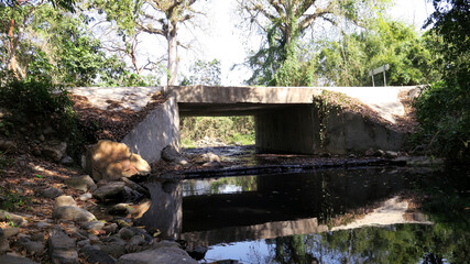 Old concrete bridge and river in the spring 2025