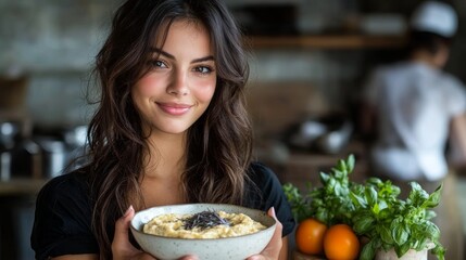 Young woman smiling, holding bowl of bagna cauda, inviting kitchen setting. Concept of enjoying bagna cauda, delightful italian anchovy dip experience, warm atmosphere.