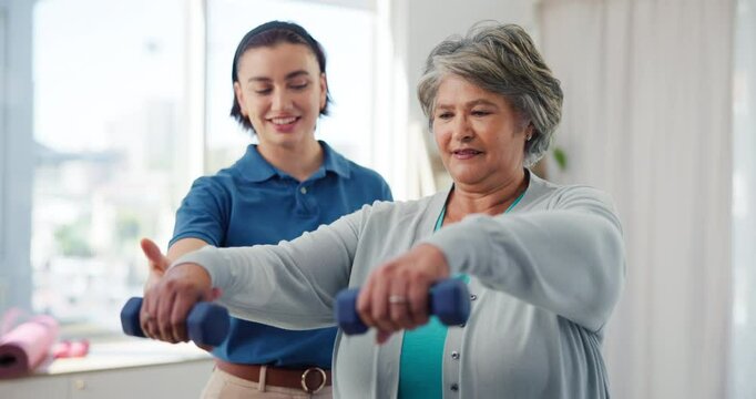 Physiotherapy, senior woman and weights in practice for rehabilitation, mobility exercise and happy for recovery progress. Specialist, elderly patient and support for wellness with muscle development