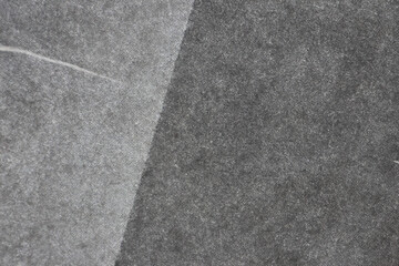 Black and gray dots printed on white paper.