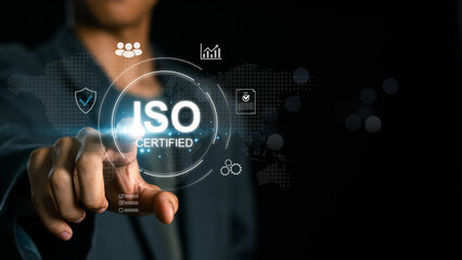 Businessman touch representation of ISO certification, icons symbolizing quality assurance, compliance, global standards, and International organization for standardization. ISO Certification Concept.