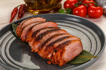 Sliced duck breast baked with cherry
